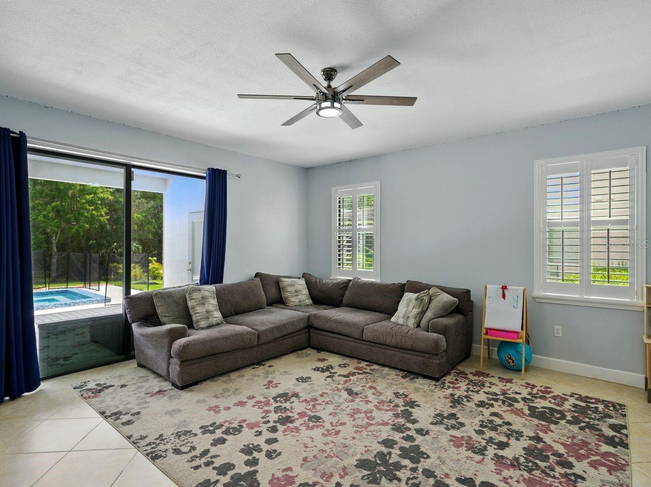 Bonus room located off kitchen with pool & patio access.