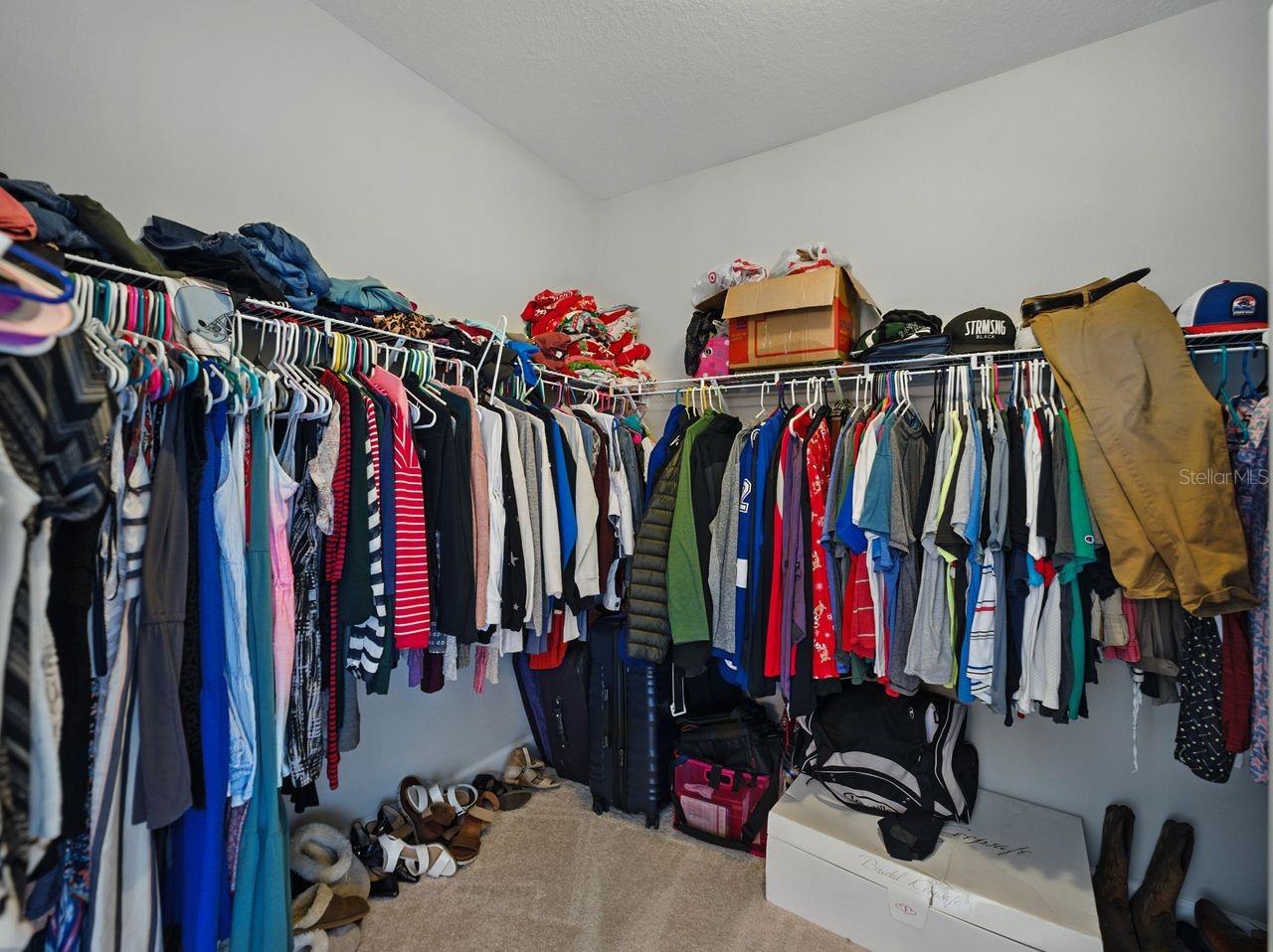 Primary bedroom walk-in closet.