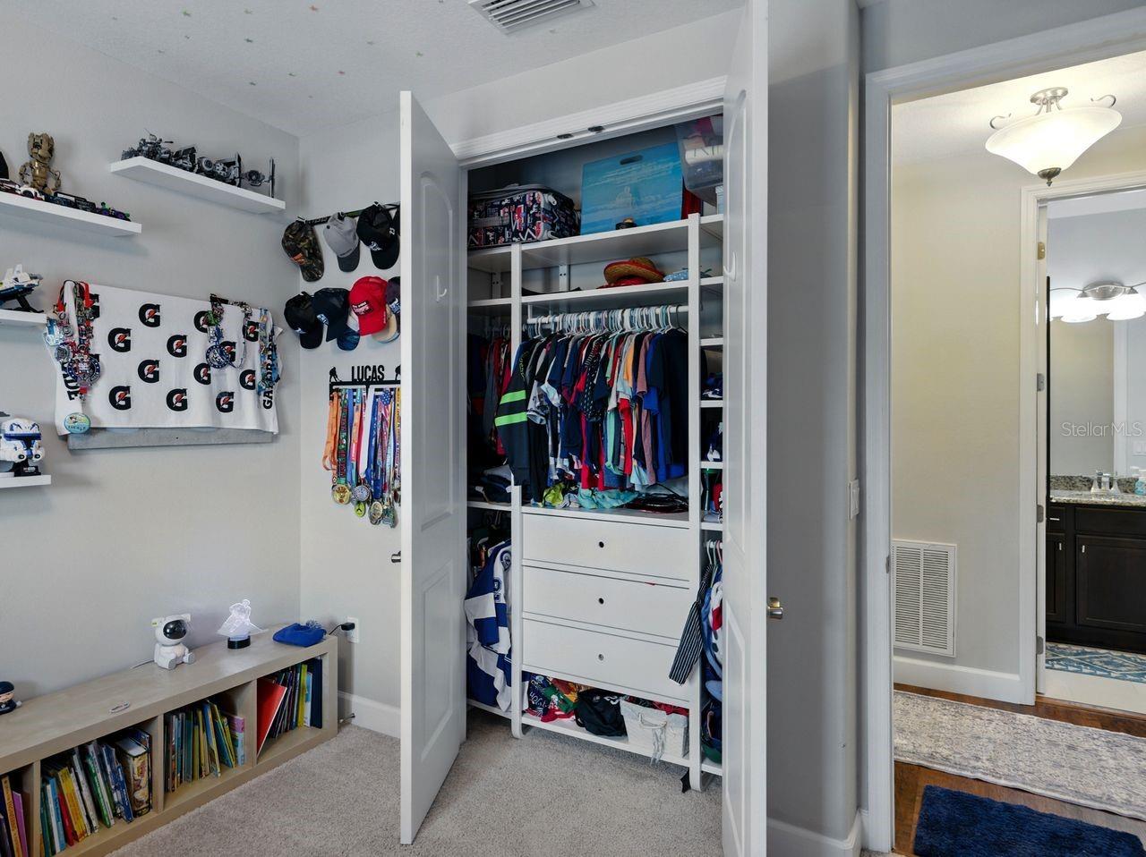 Bedroom 3 custom closet storage.