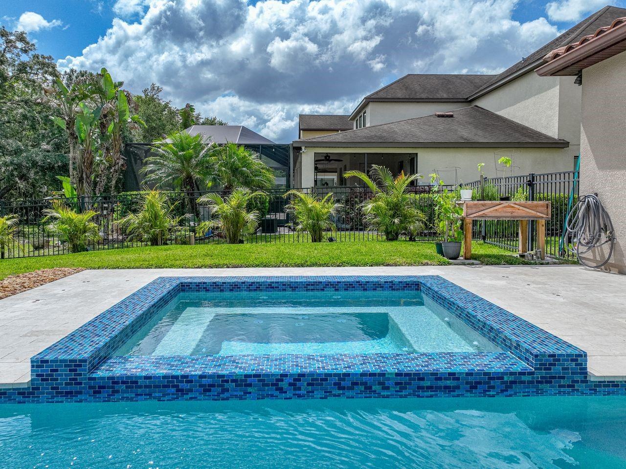 Large built-in spa is perfect for relaxing and enjoying the beautiful outdoors.