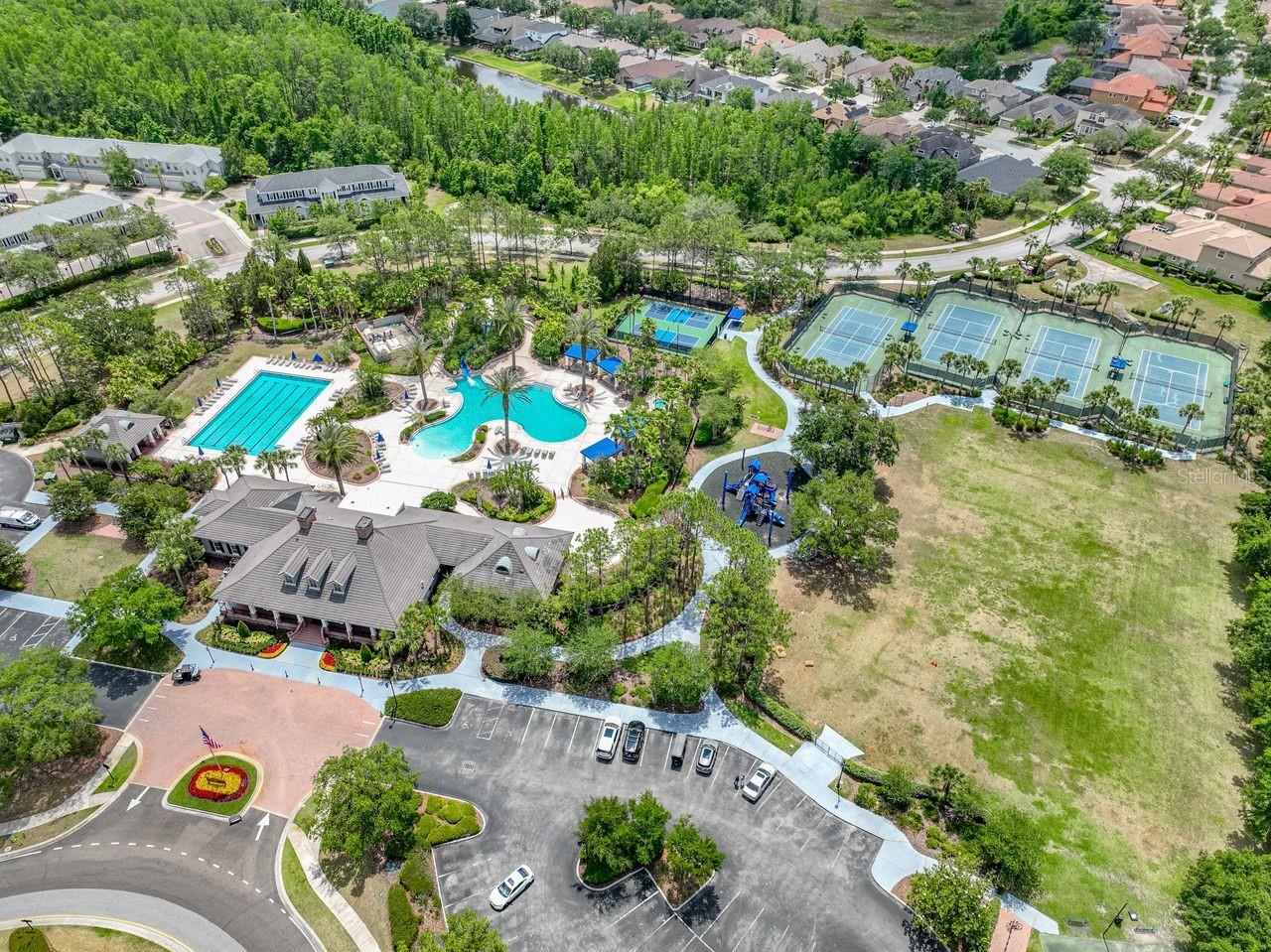 Community Center Features two large pools, fitness center, Playground area for children, Basketball, tennis & Pickleball courts.
