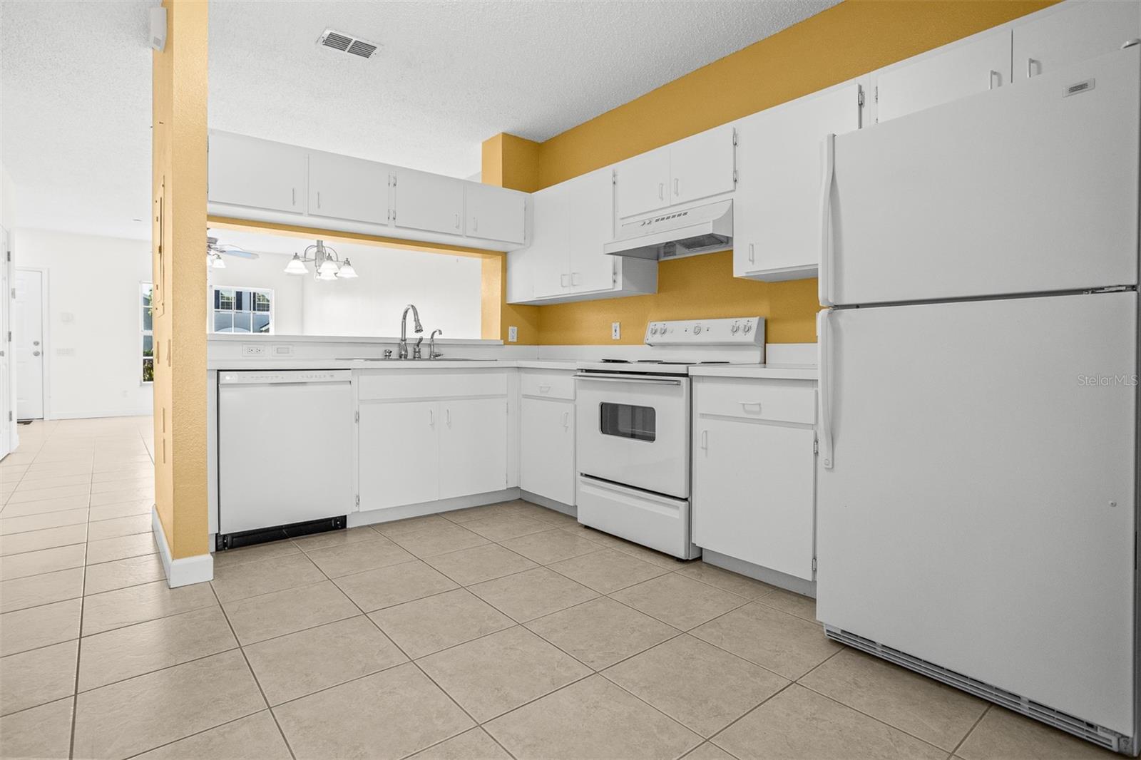 Kitchen is light and bright with Washer and dryer closet located right here