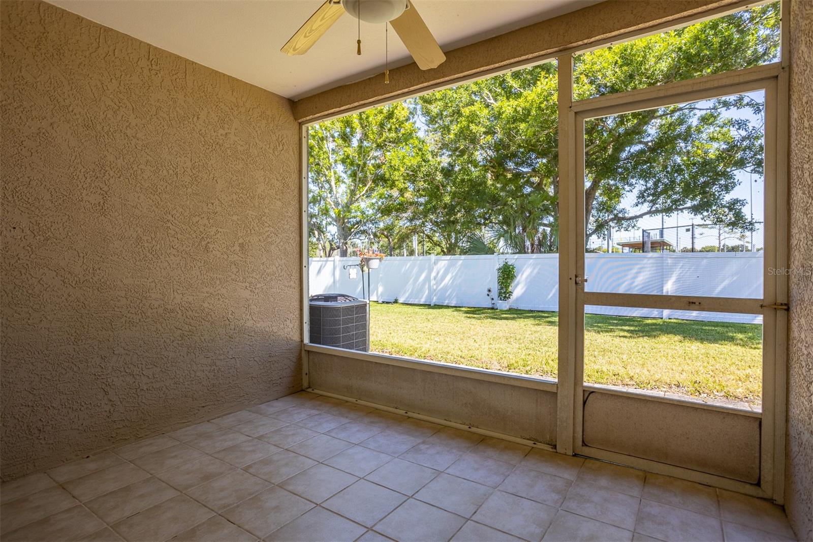 Screened private patio out back, faces to the north