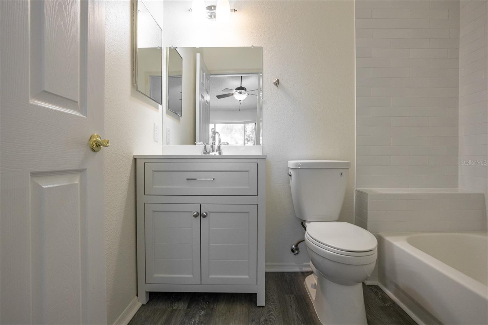 The primary bathroom is freshly tiled and renovated