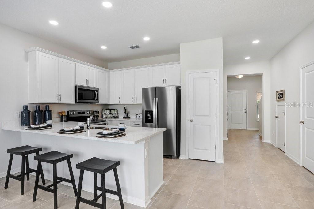 Kitchen with lots of cabinets! (photo of staged model)