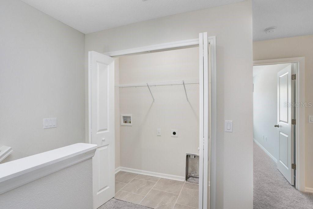 Convenient Upstairs Laundry (photo of staged model)