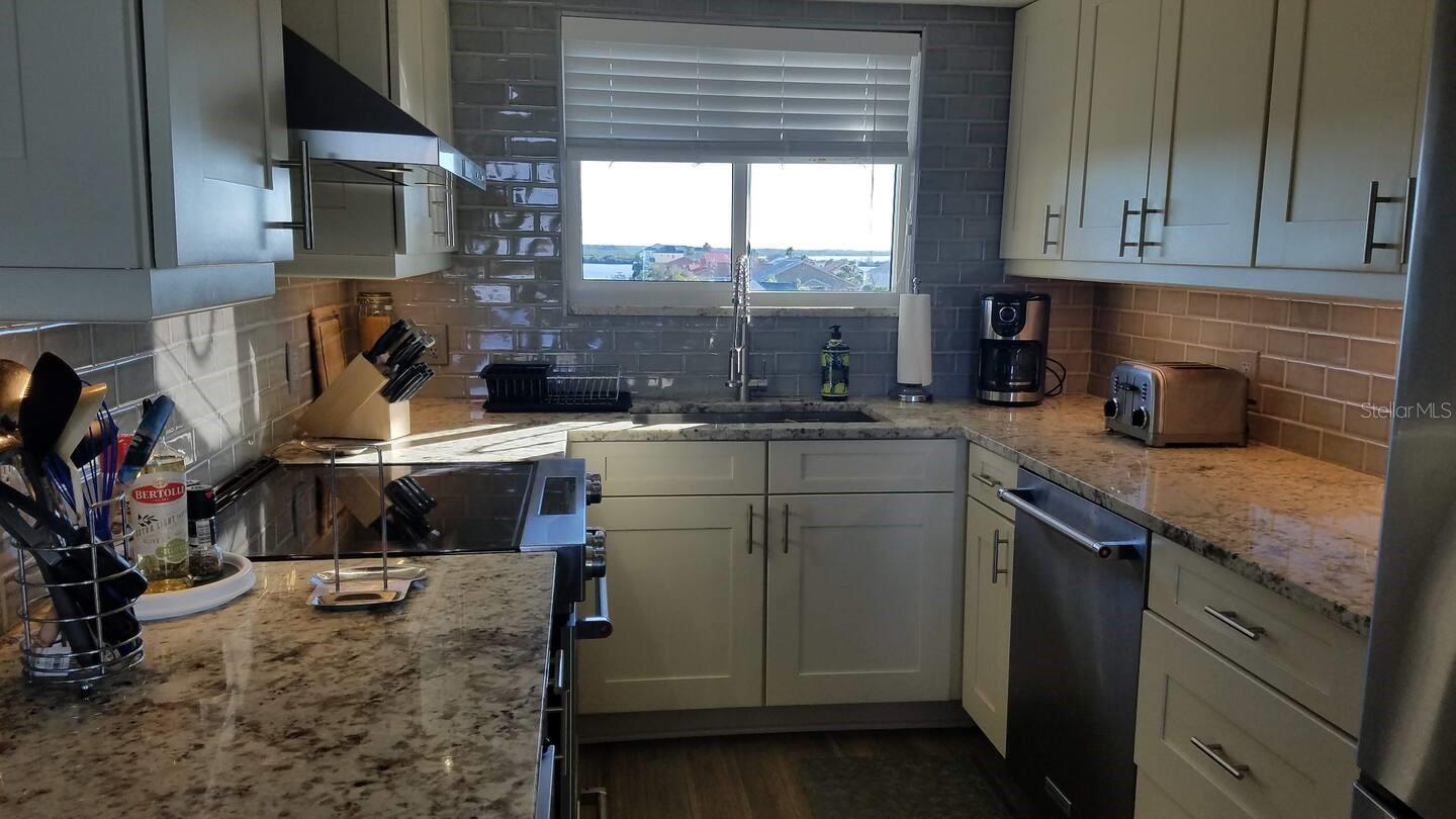 Gourmet kitchen with KitchenAid appliances and a wine fridge