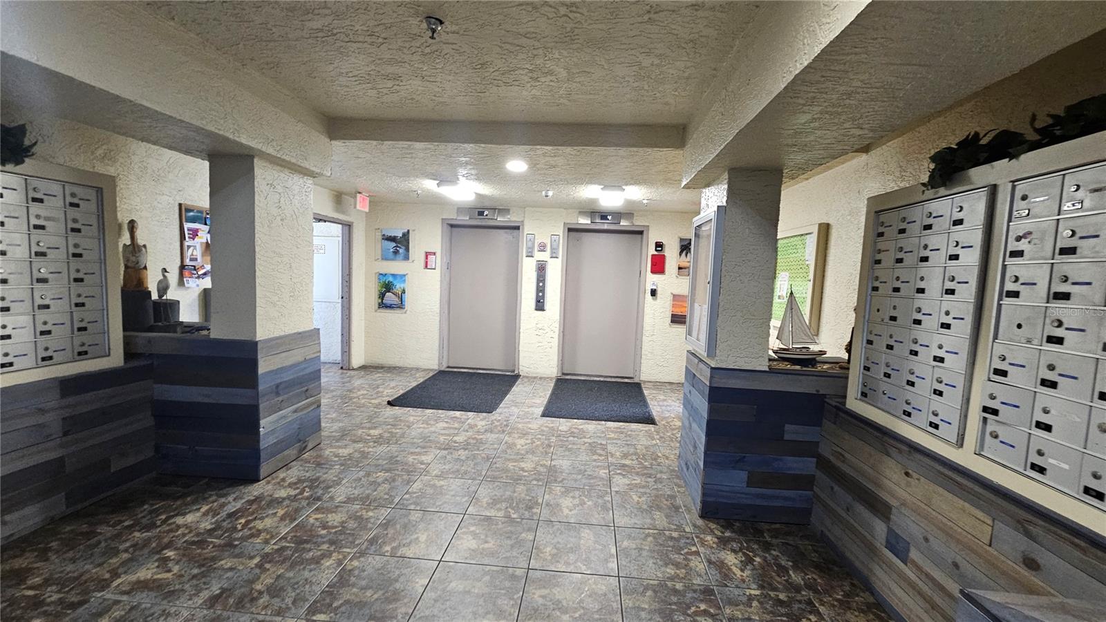 bldg 3 lobby with elevators, mailboxes