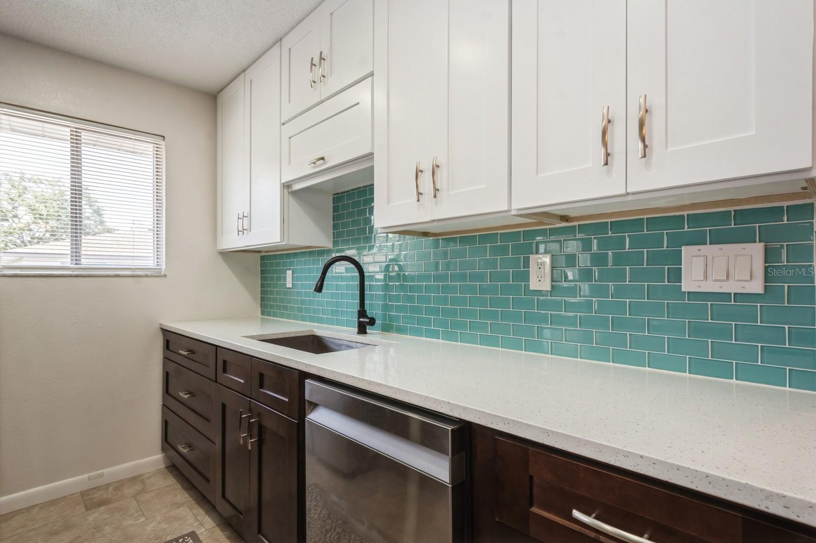 Great pop of color with the glass tile backsplash