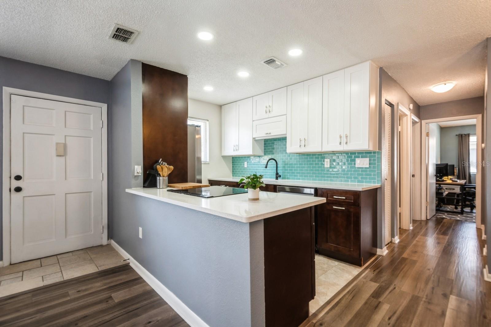 Kitchen open to living room and dining area