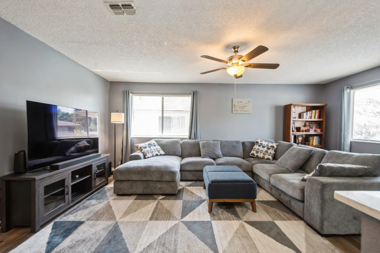 Large living room with lots of natural light