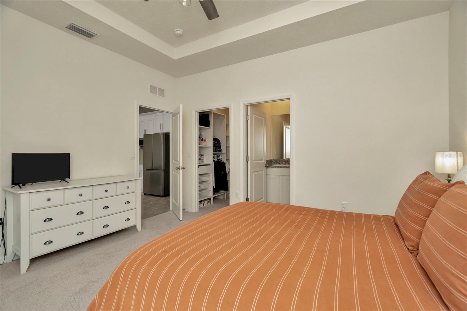 In-law suite bedroom w/ custom walk-in closet and en-suite