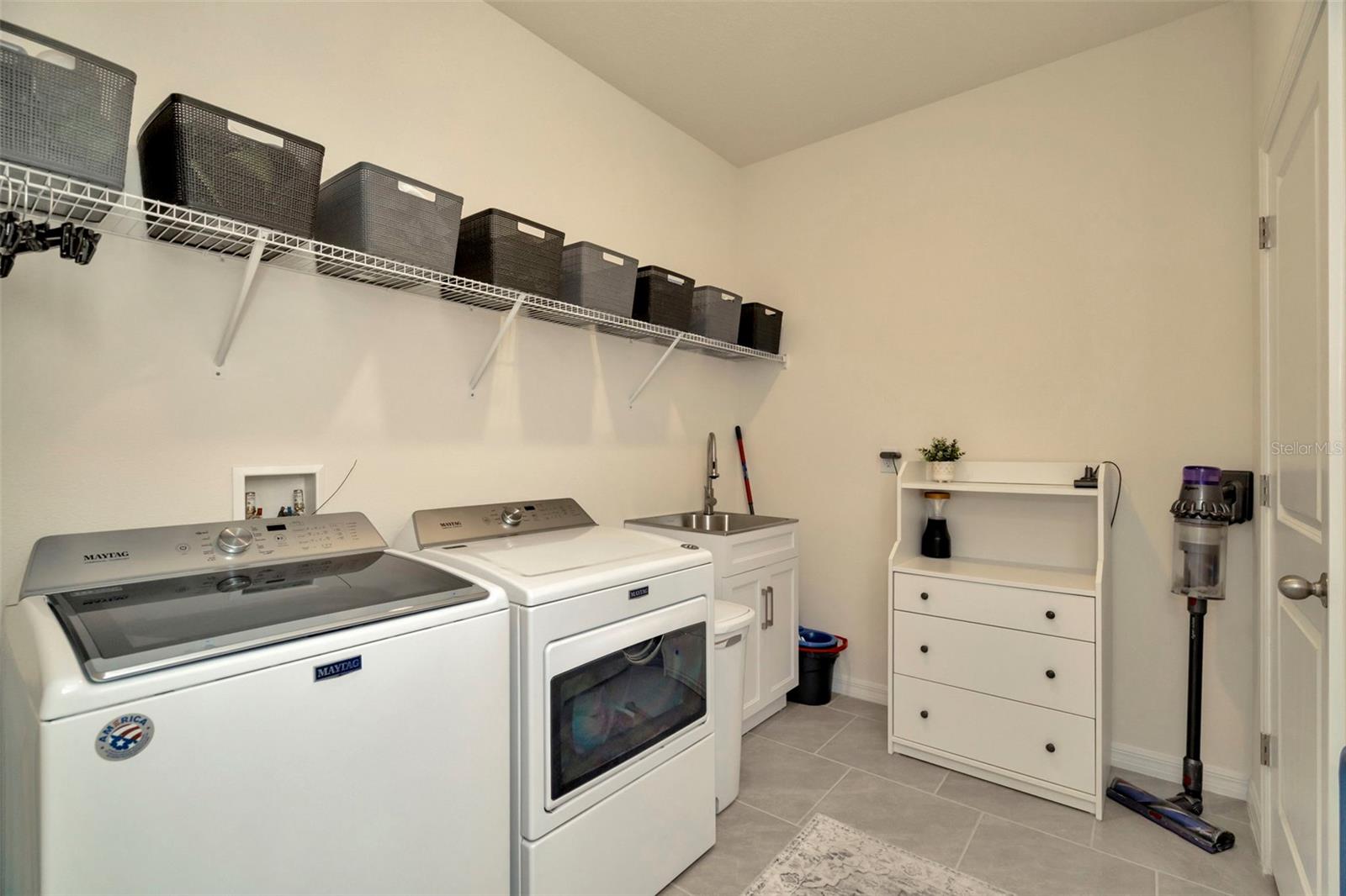 Laundry room w/utility sink and cabinet combo