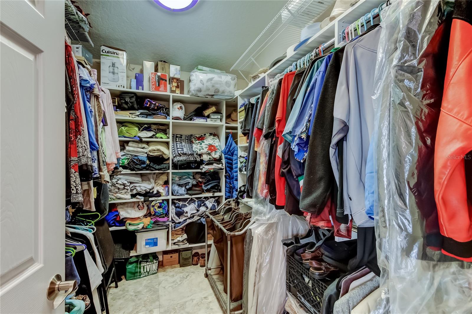 Primary bedroom walk in closet