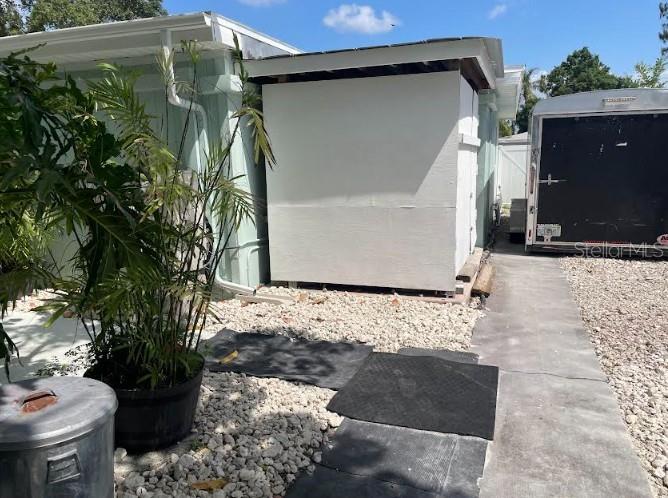 Trailer parking and ventilated-covered work area