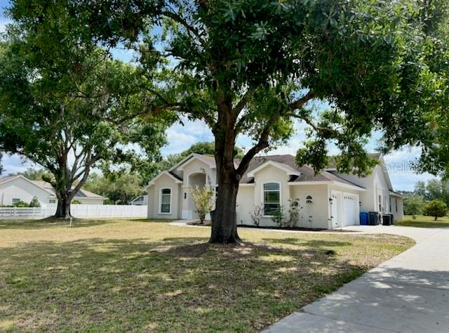 Exterior Front with Driveway Leading to 3 Car Garage