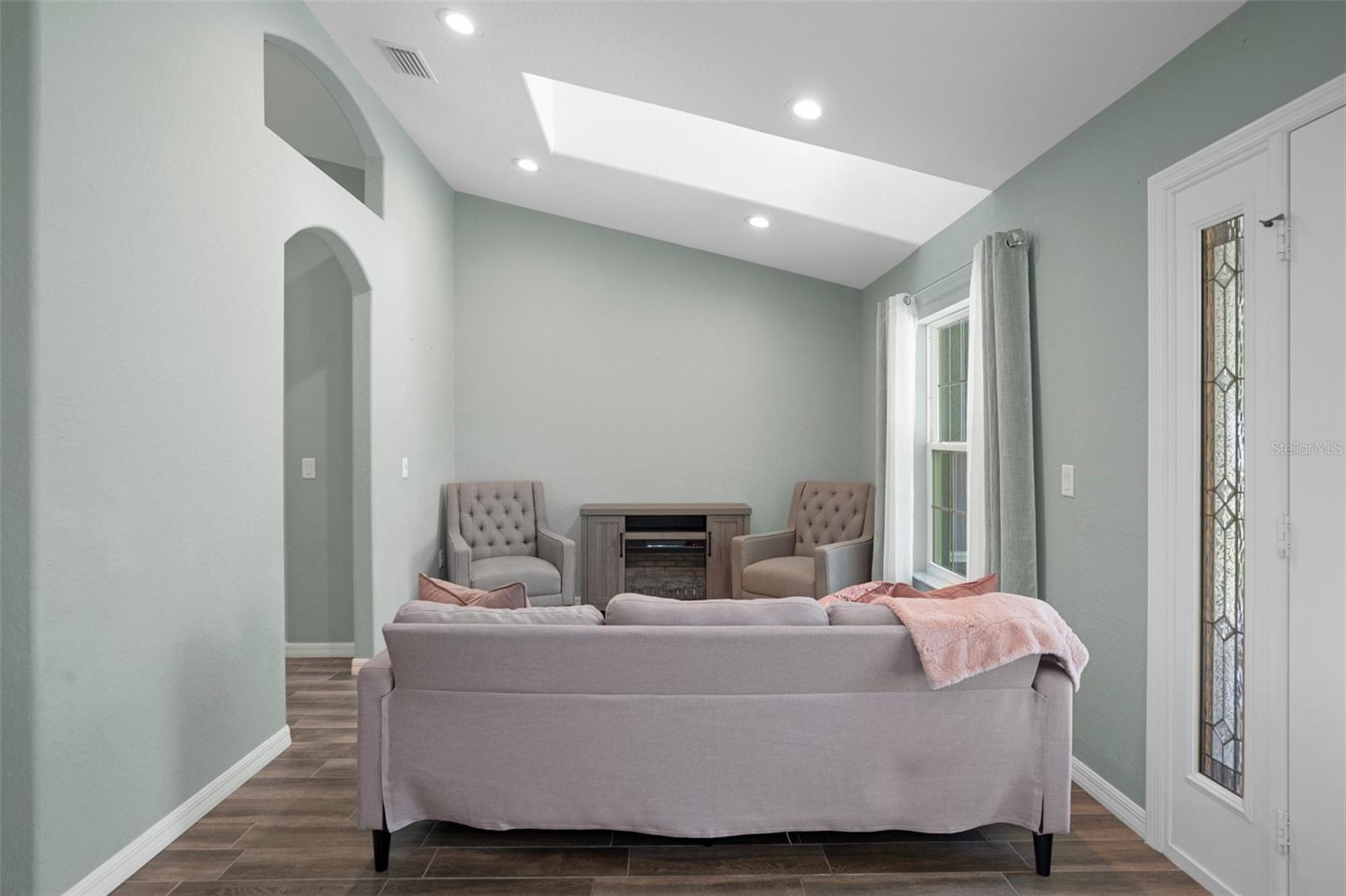 Dormer windows in the formal living room provide additional light and are beautiful