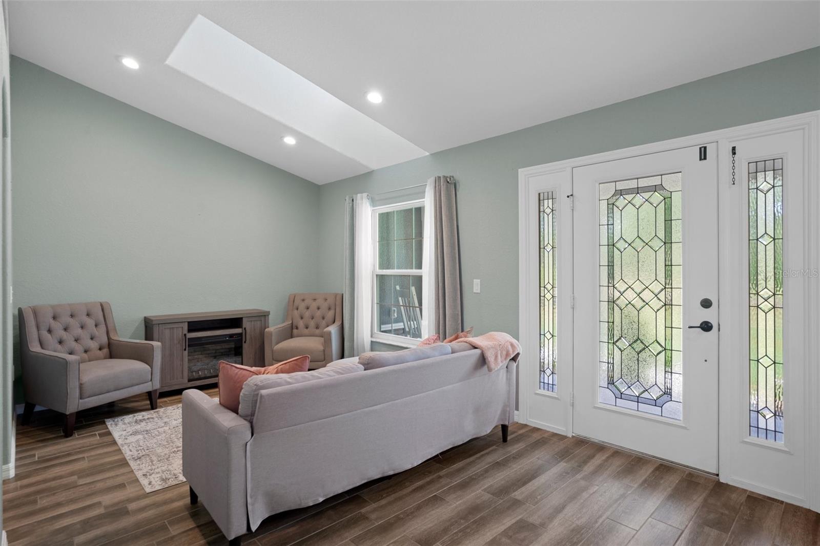 View of the beautiful front door and formal living room