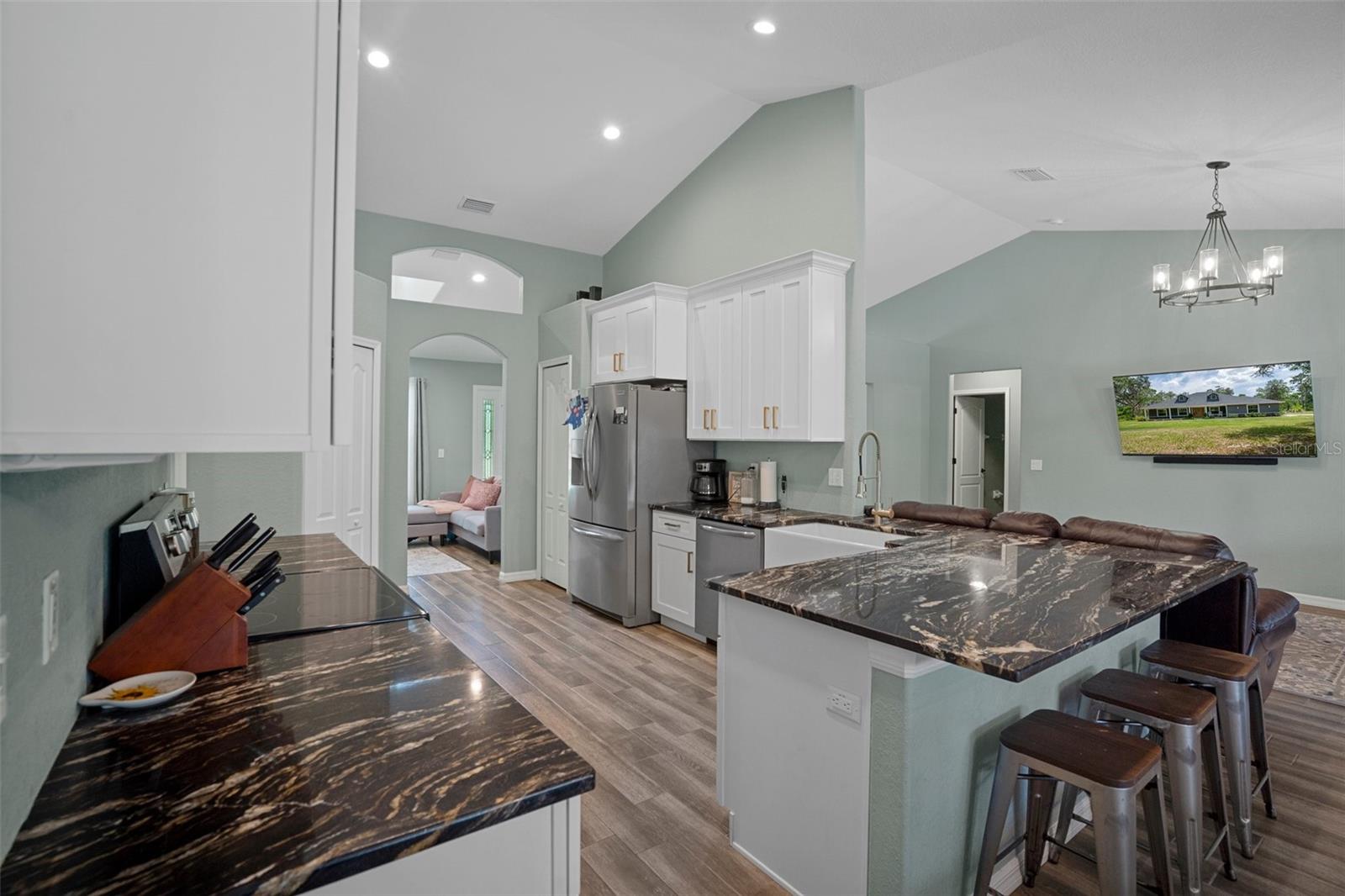 There are stunning granite counter tops in this gorgeous kitchen