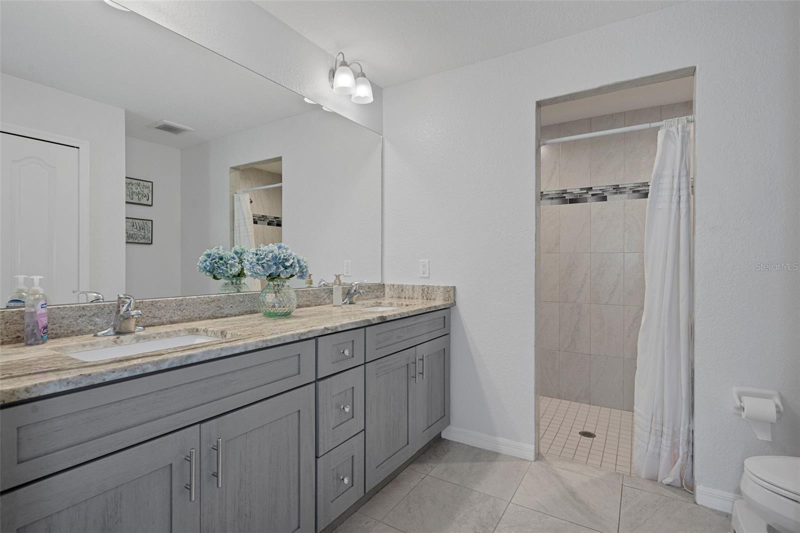 Gorgeous Vanity in the master bedroom with dual sinks and granite top