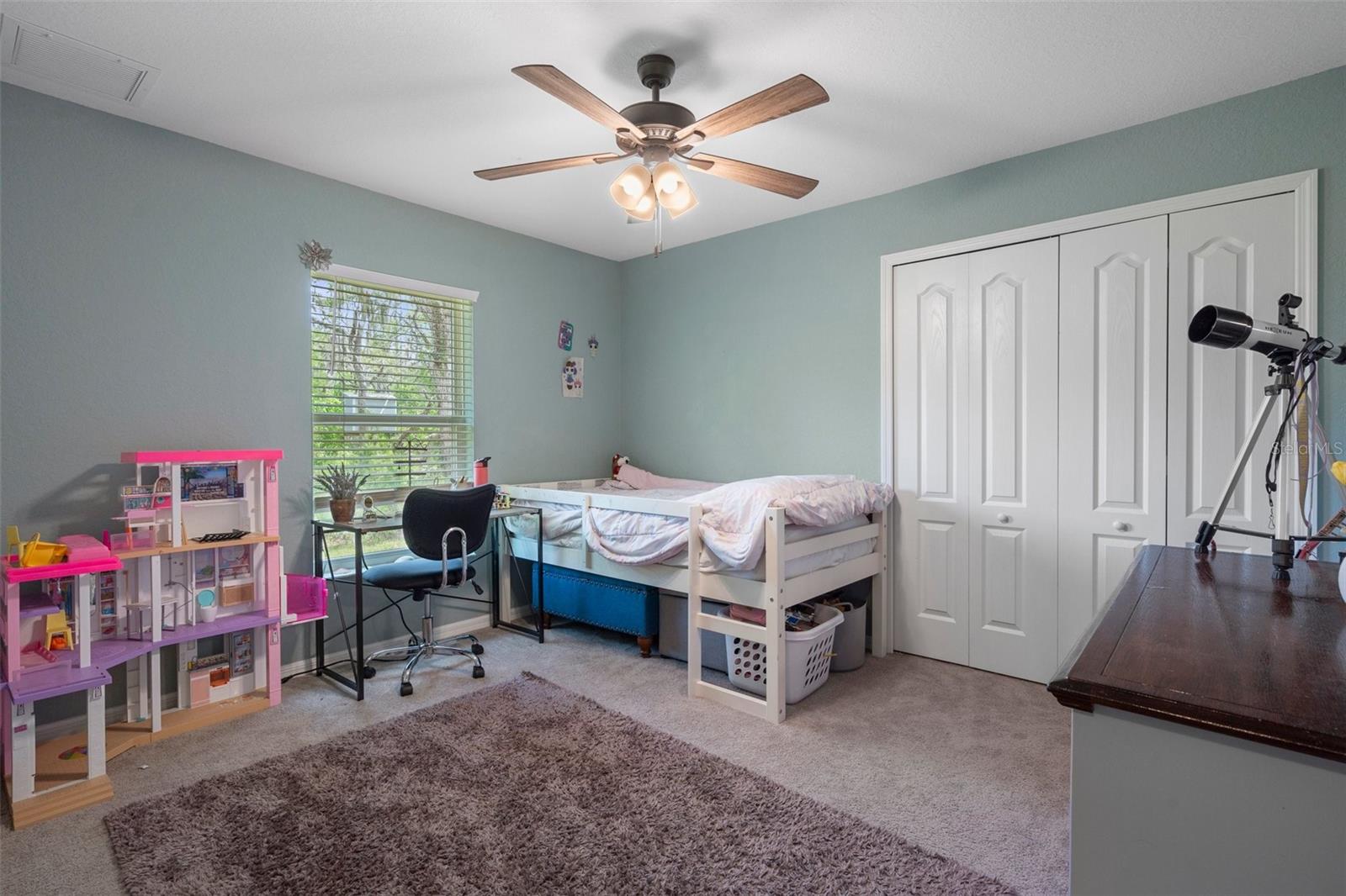 This bedroom is open and bright