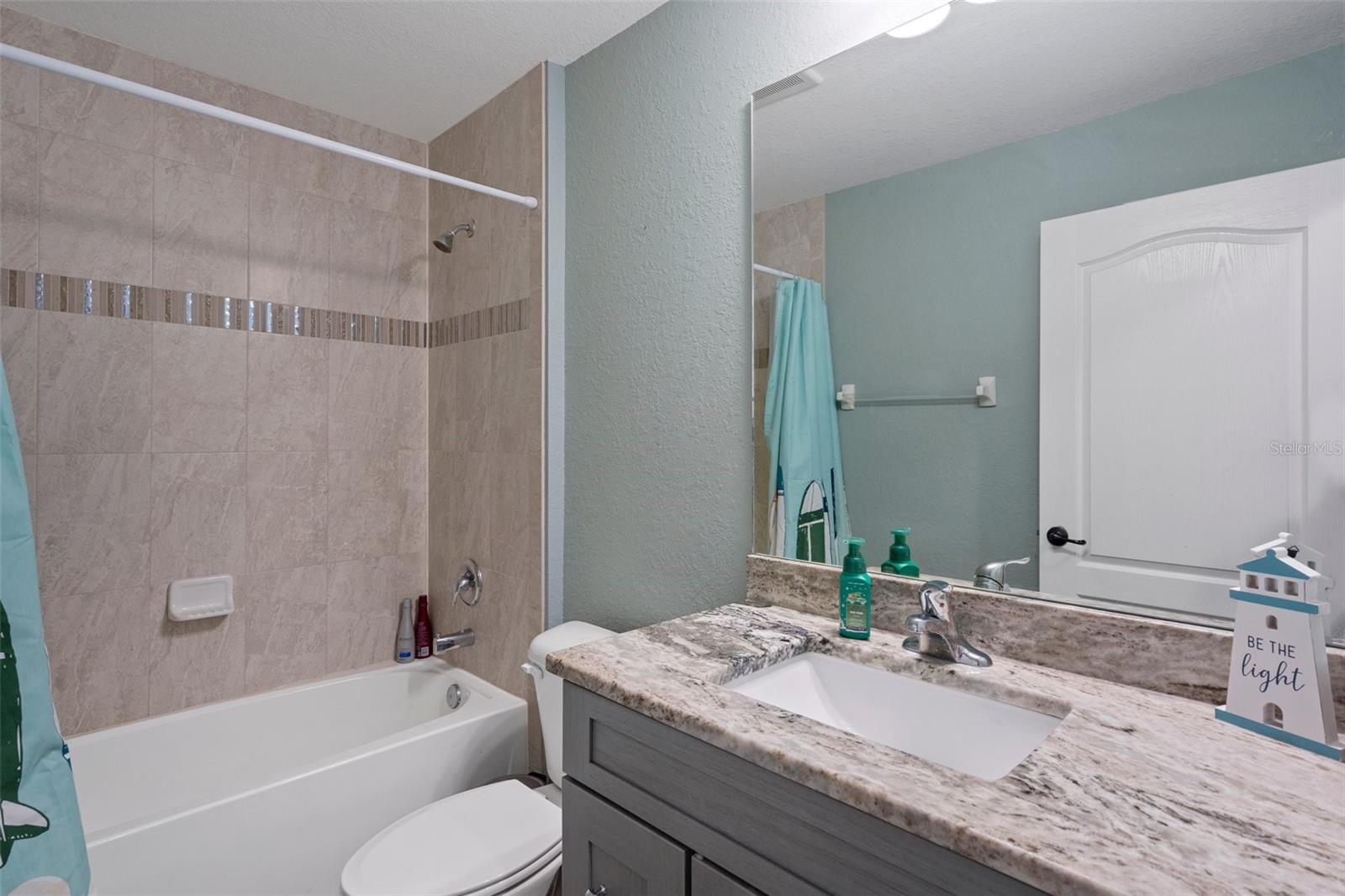 Guest Bathroom with a vanity with granite top