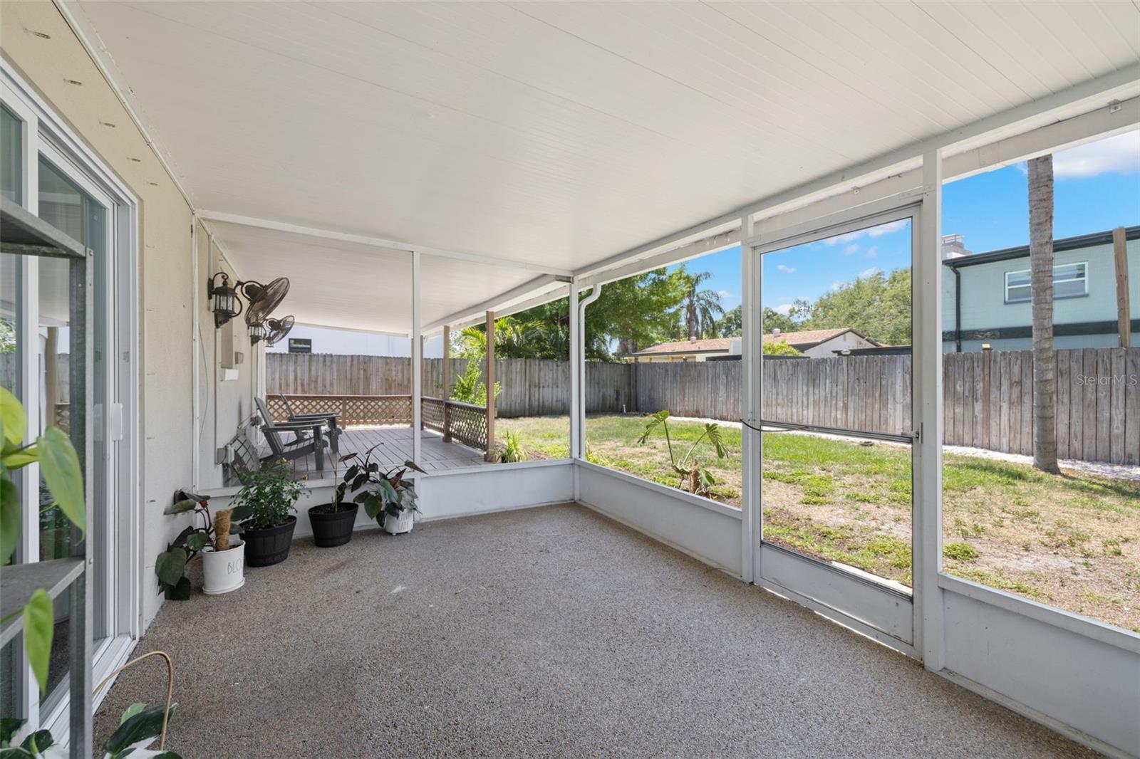 Screened-in patio in the backyard | access from primary bedroom suite