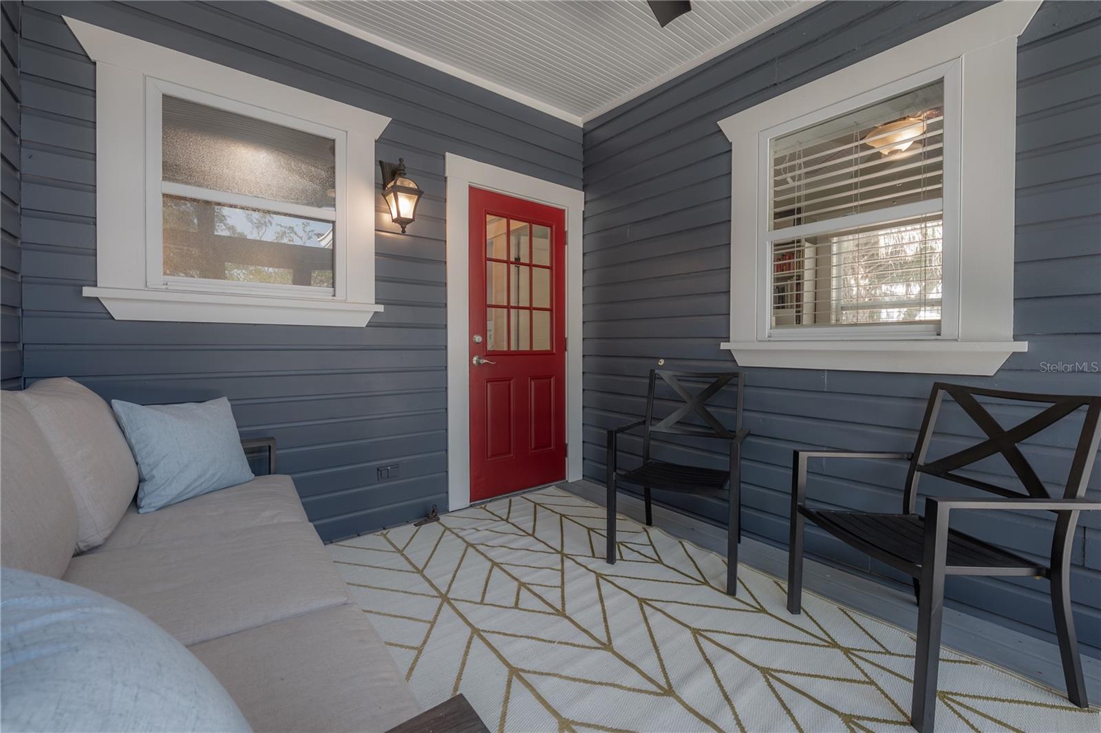 Completely screened in back porch, with a roof to protect from the sun.