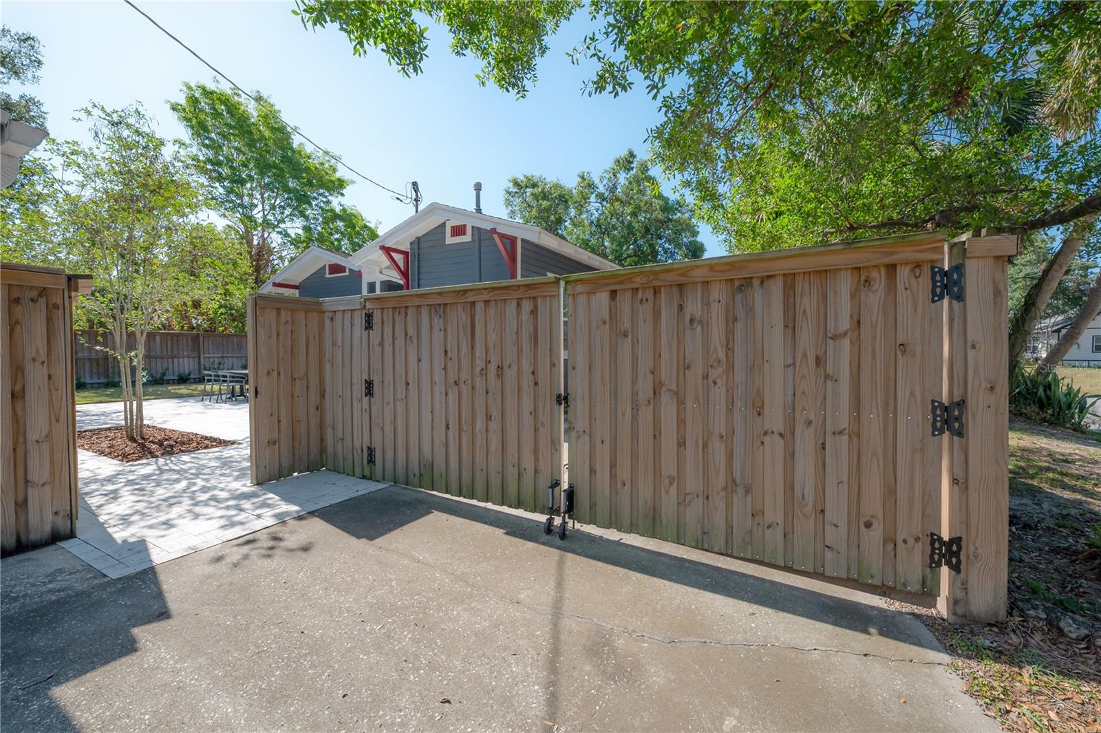 Pedestrian gate to the backyard, next to the detached garage. There is also a double gate for Boat or RV parking!