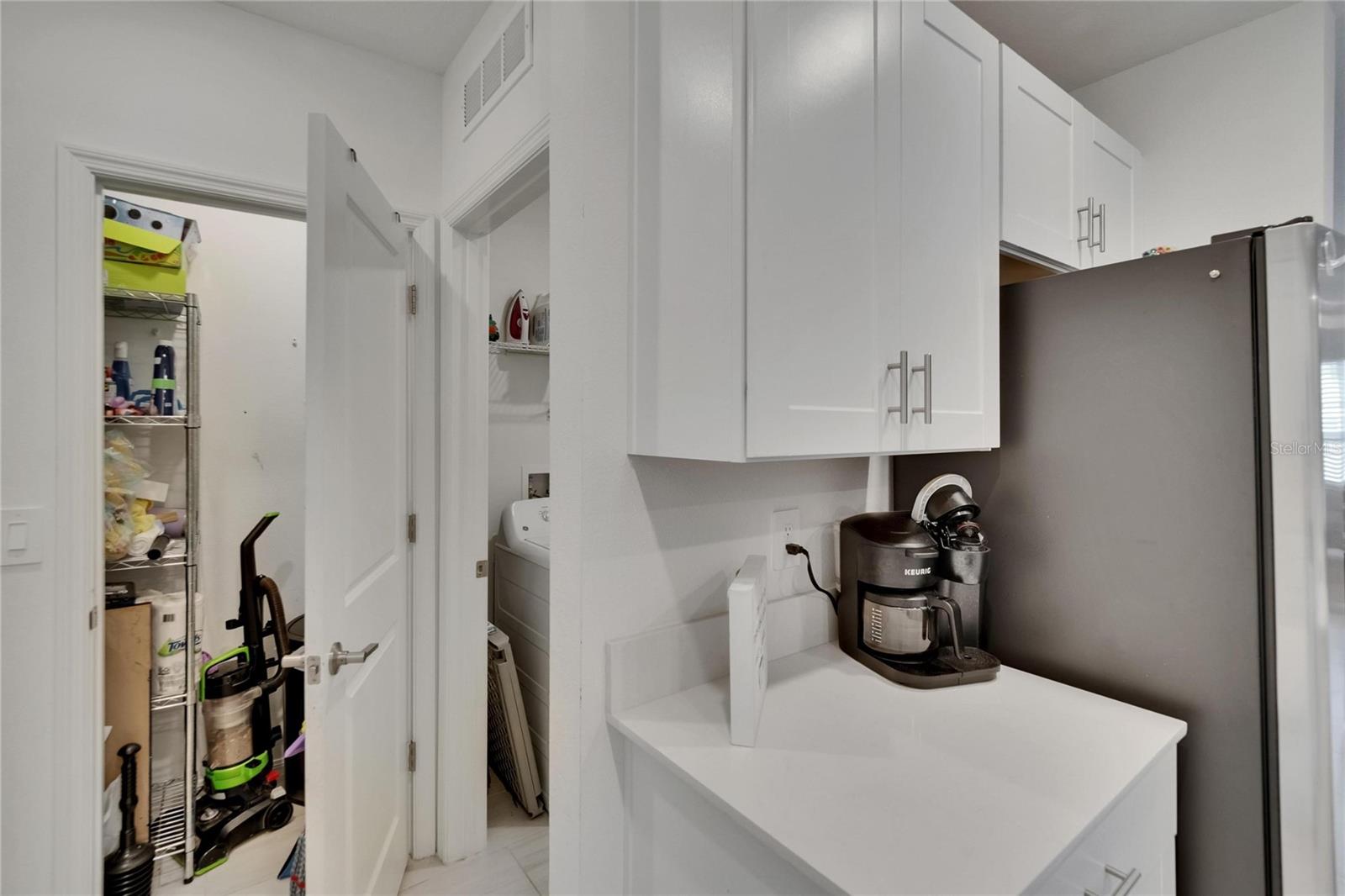 Entry to utility closet and laundry room