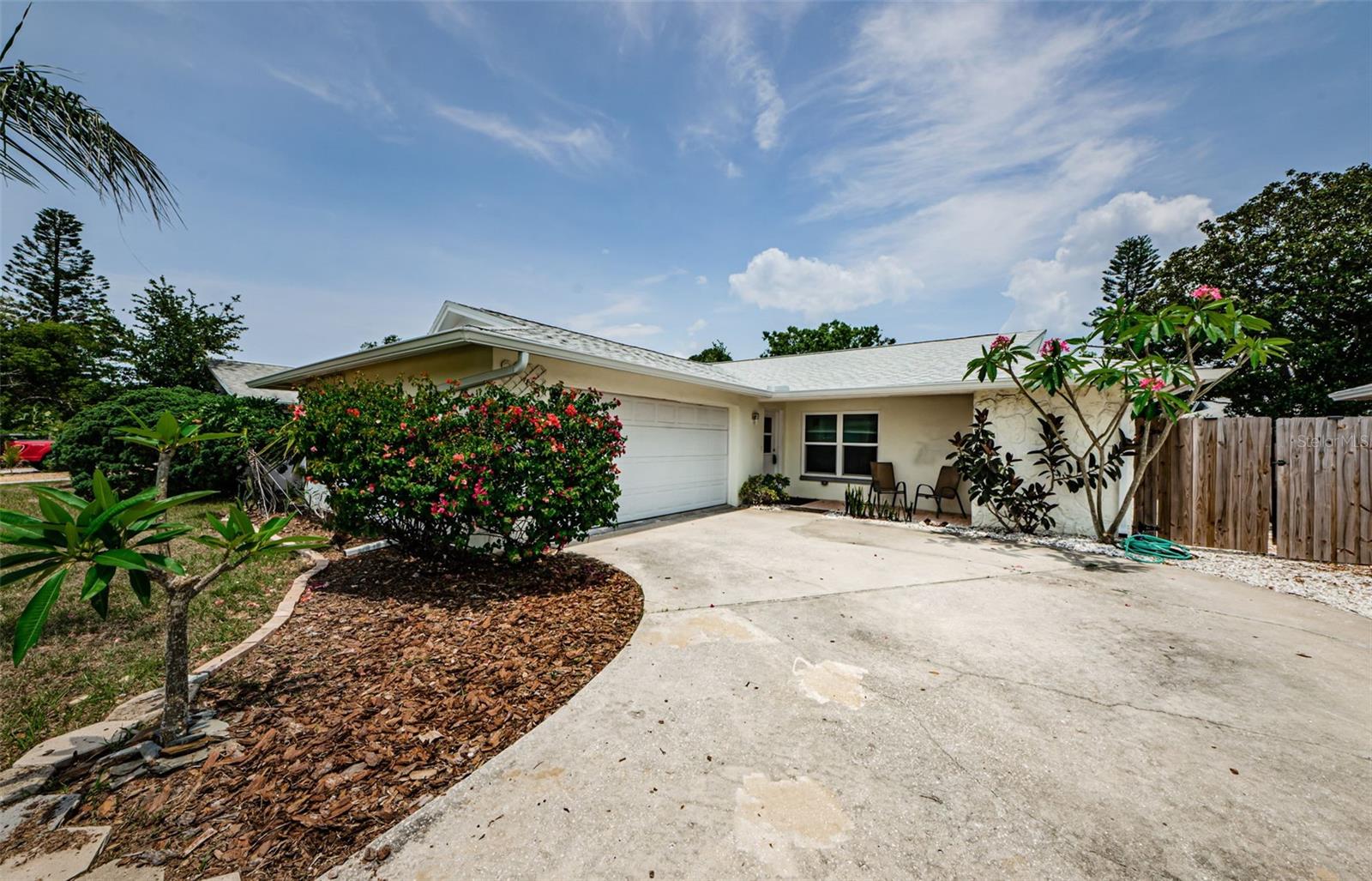 Driveway and view of front of home.  Garage is on the side.
