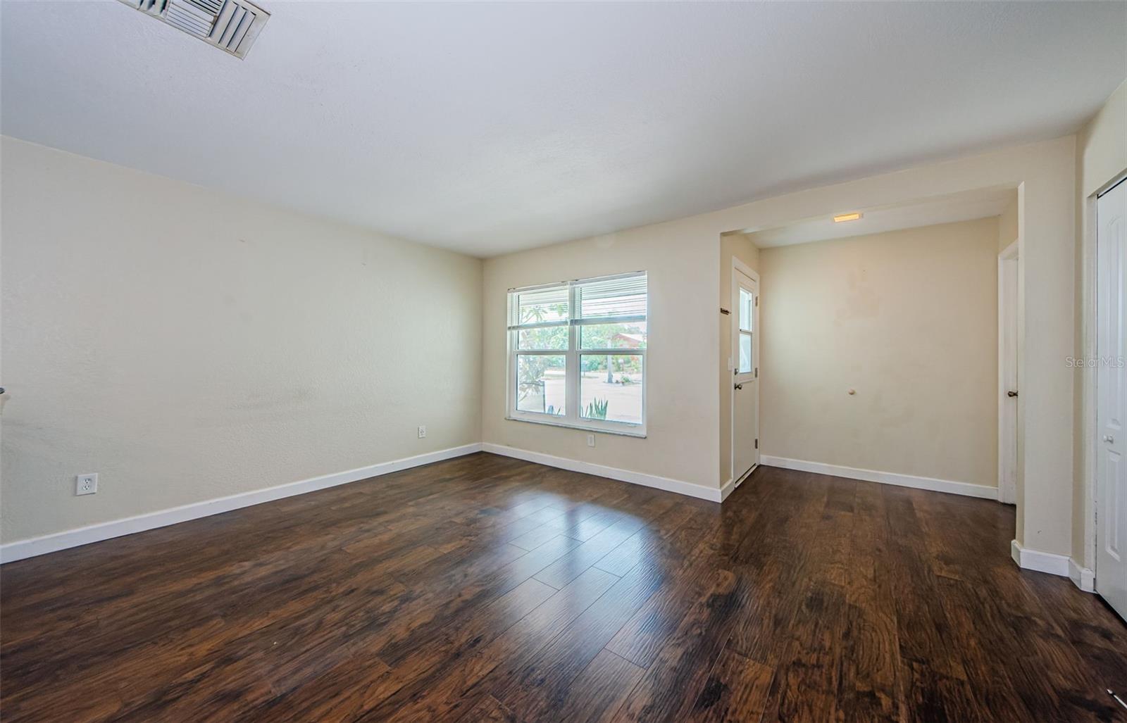 Living room window and hallway to front door.