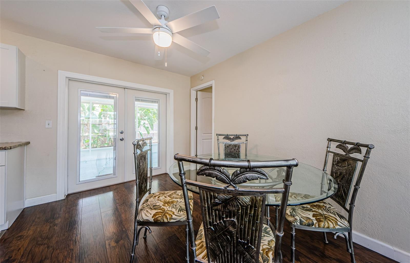 Dining area and door to primary bedroom and back covered porch.