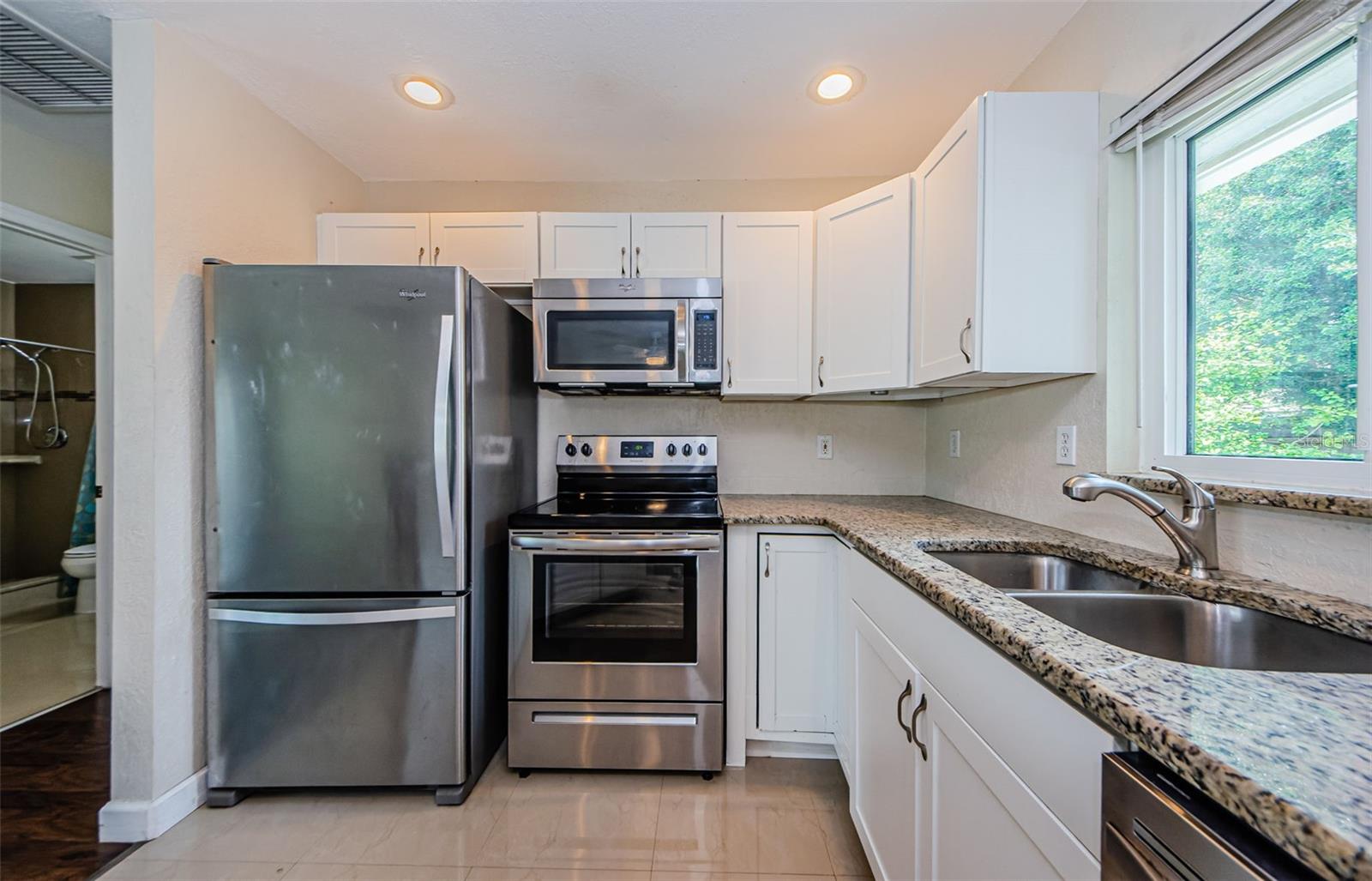 Kitchen and view into hallway.