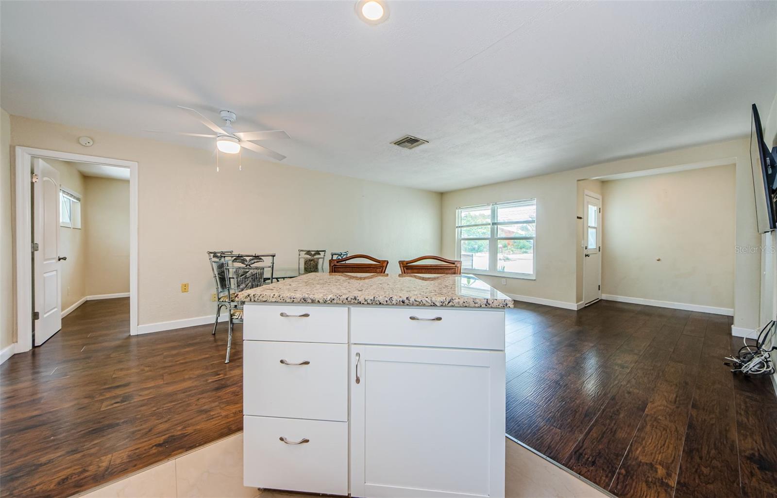 Angle of living room from kitchen area with island.