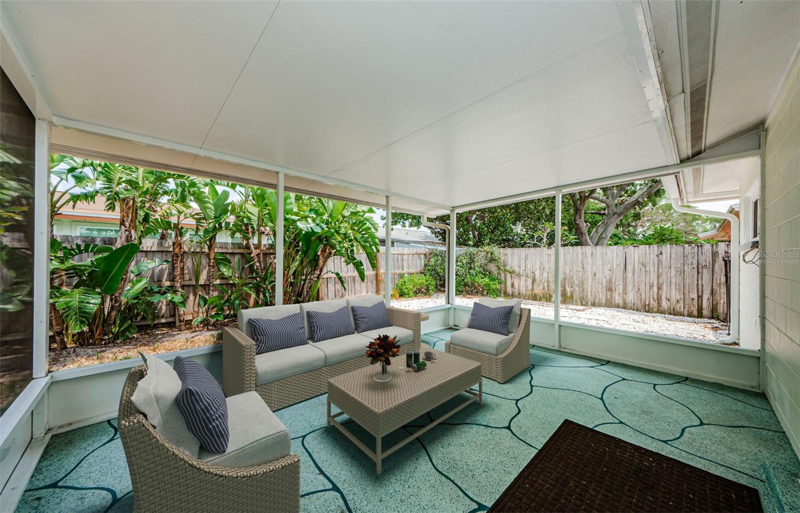 Virtually staged image of screened and covered back porch.