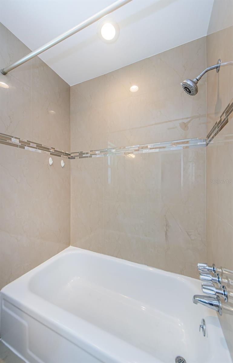Tub/Shower combo in primary bathroom.