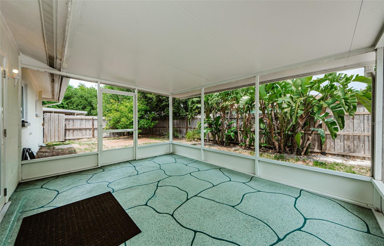 New screened and covered porch in backyard.