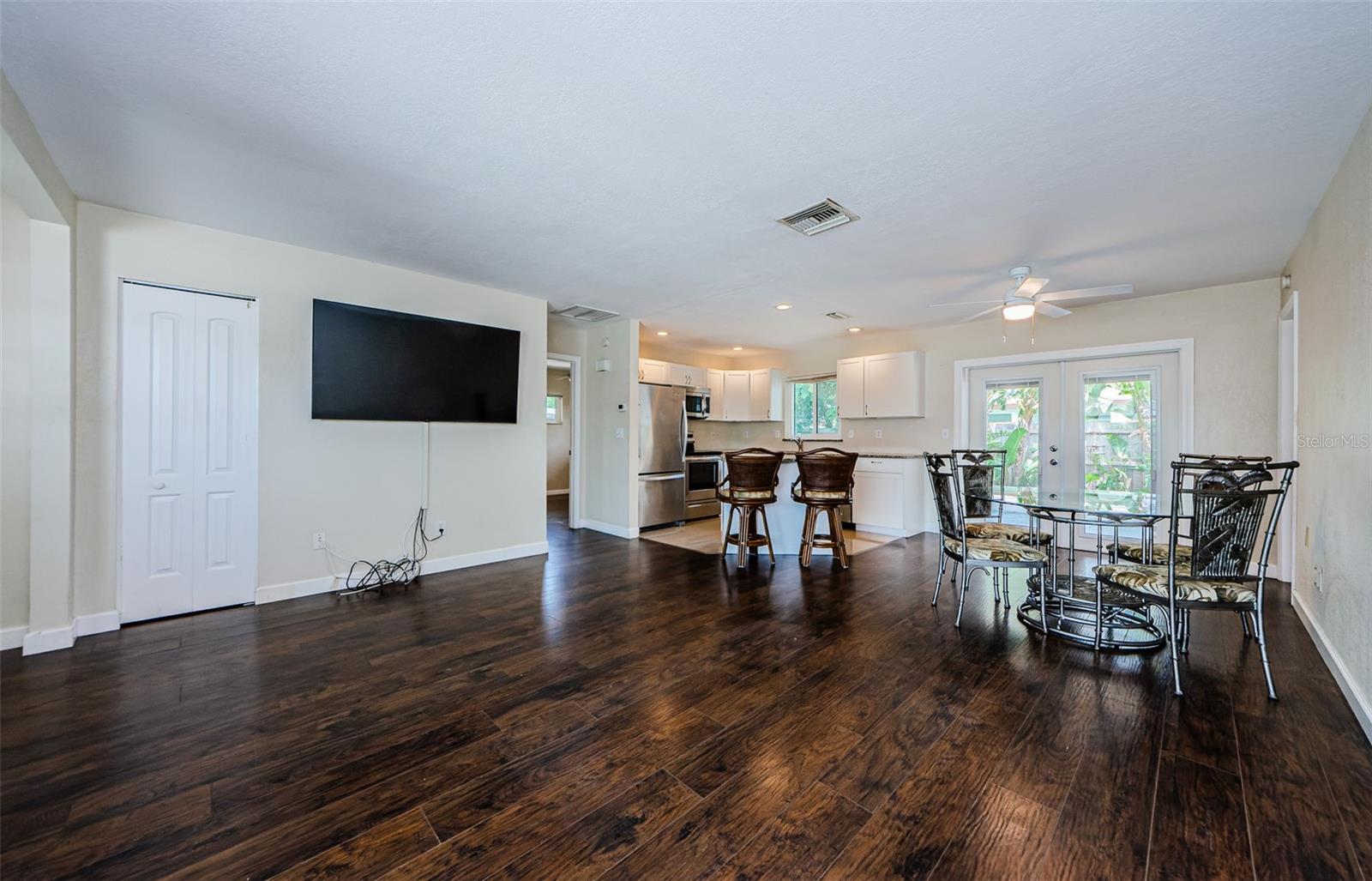 Another angle of dining area, living room and kitchen.