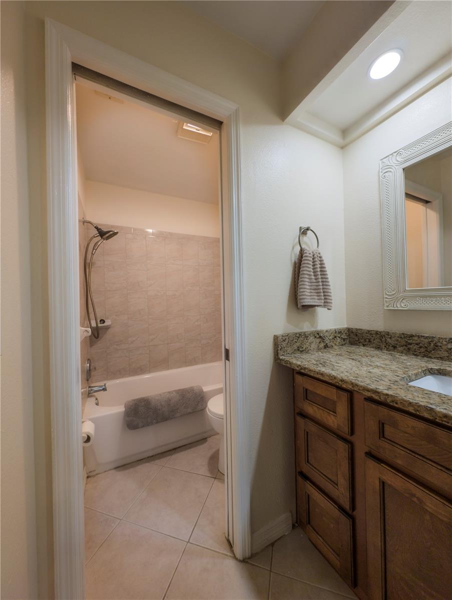 Bath has a pocket door for privacy and separation