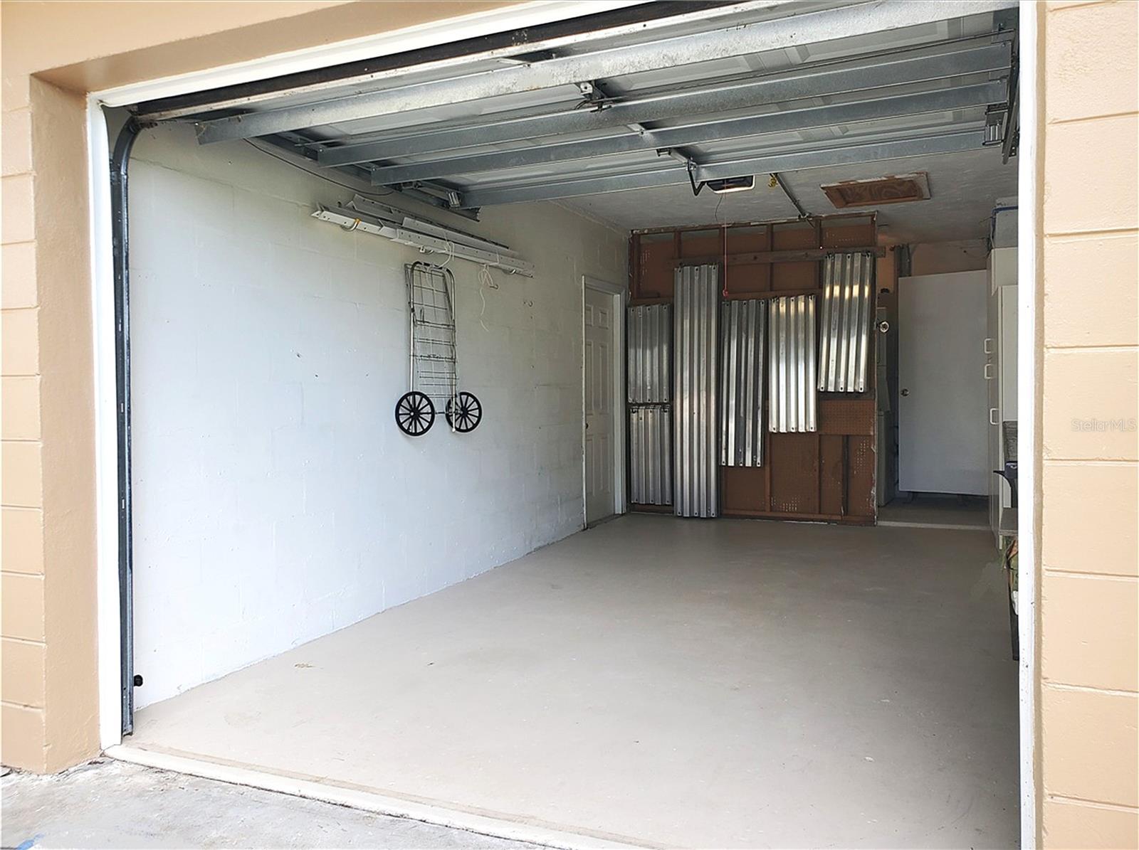 Metal storm shutters stored in the garage