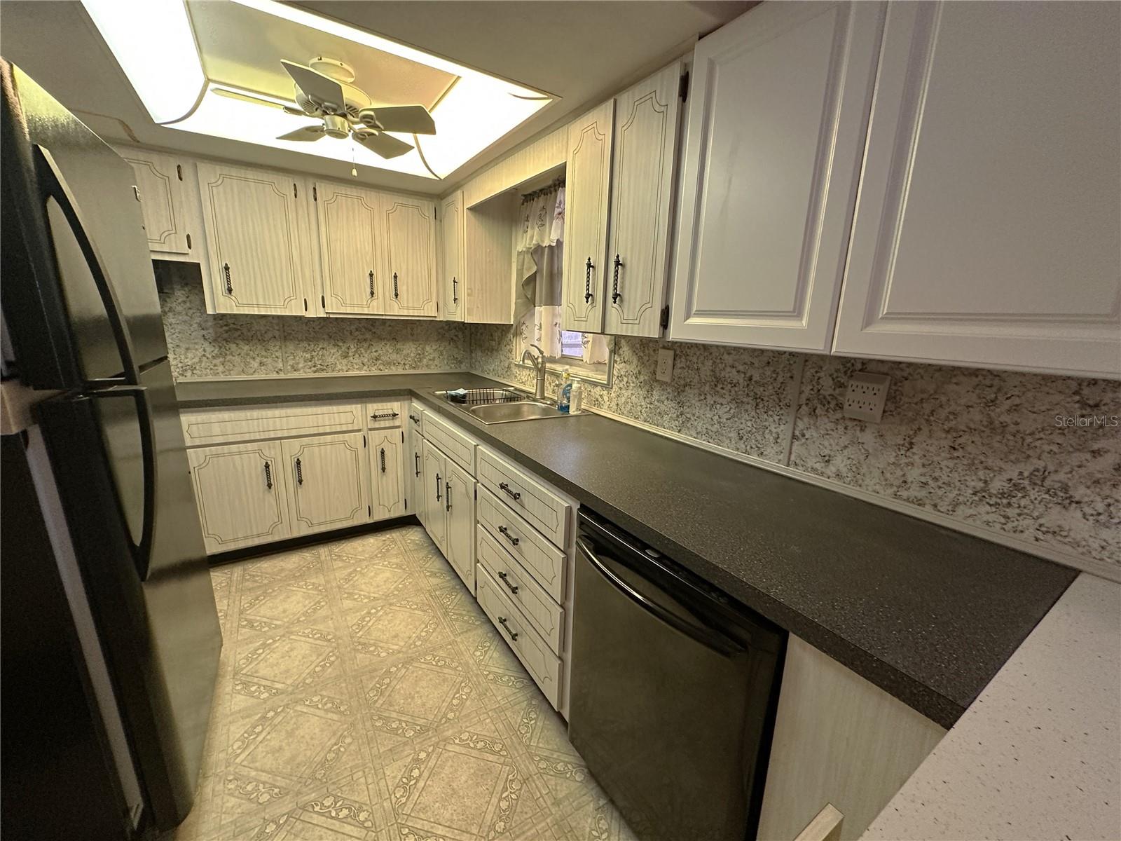 View of the kitchen looking back towards the range