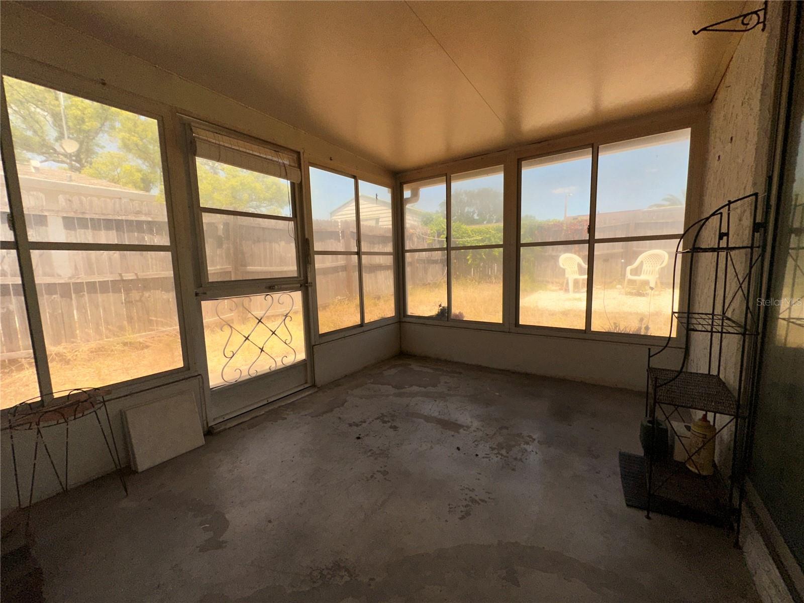 Rear screen porch with vinyl windows