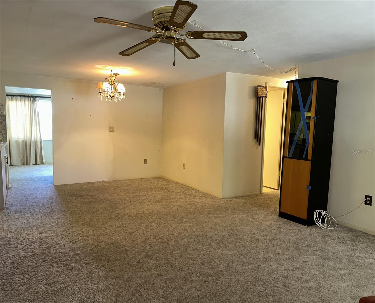 View of the living room and the dinig area in the background