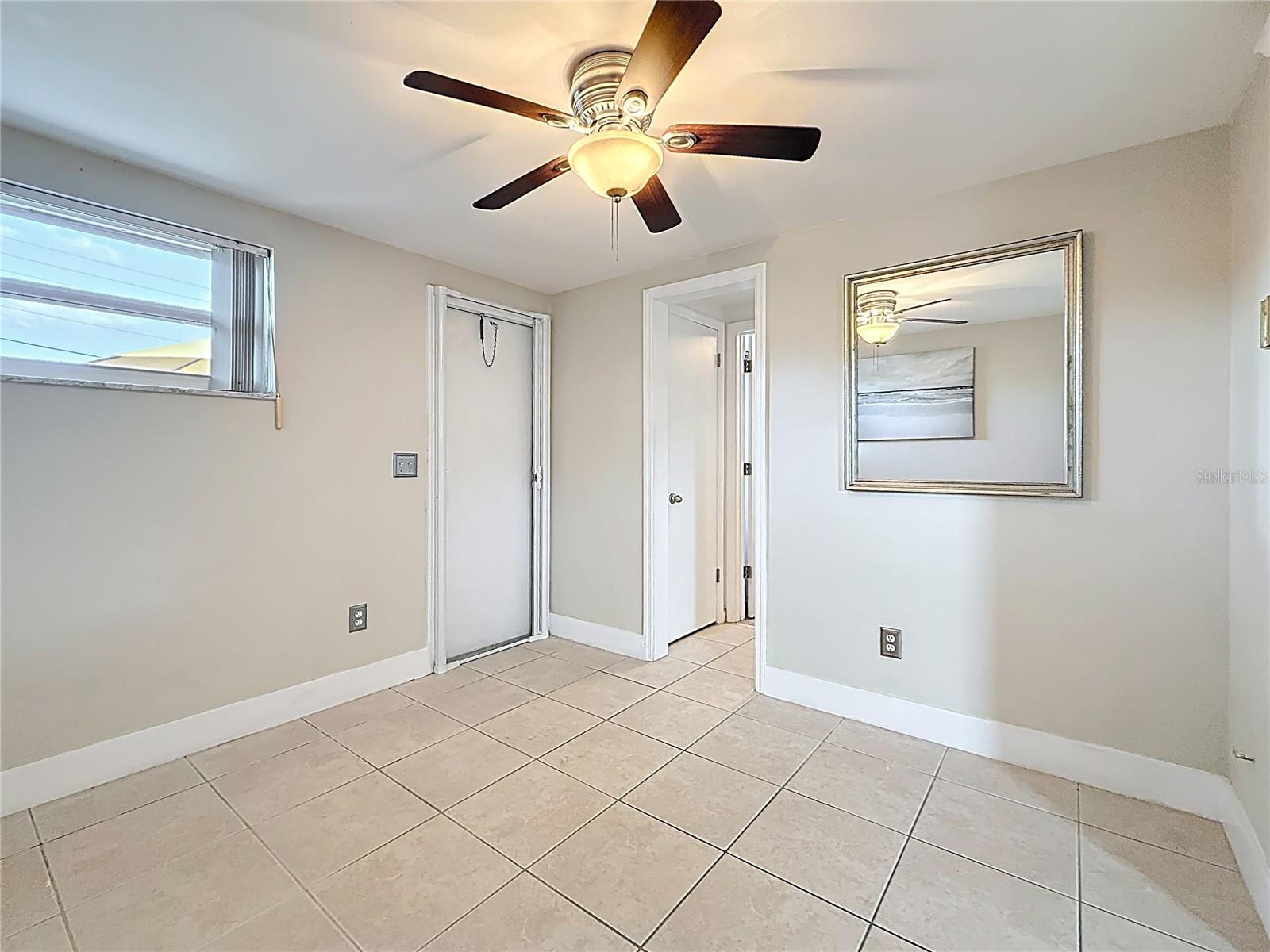 Bedroom 2 - Door To Rear Patio and Large Fenced Yard - Access to Full Bath