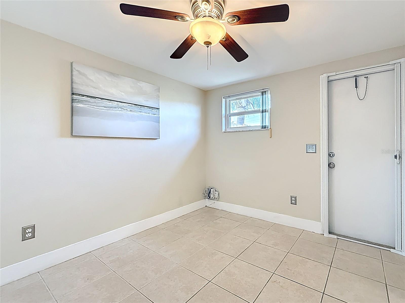 Bedroom 2 - Door To Rear Patio and Large Fenced Yard