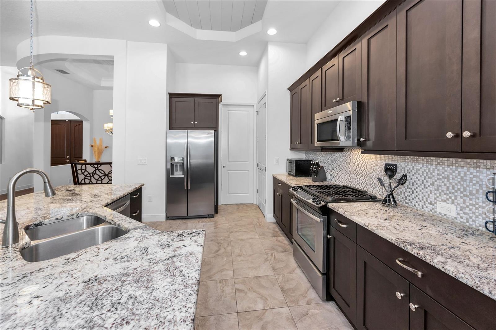 Closet pantry to the right of the refrigerator