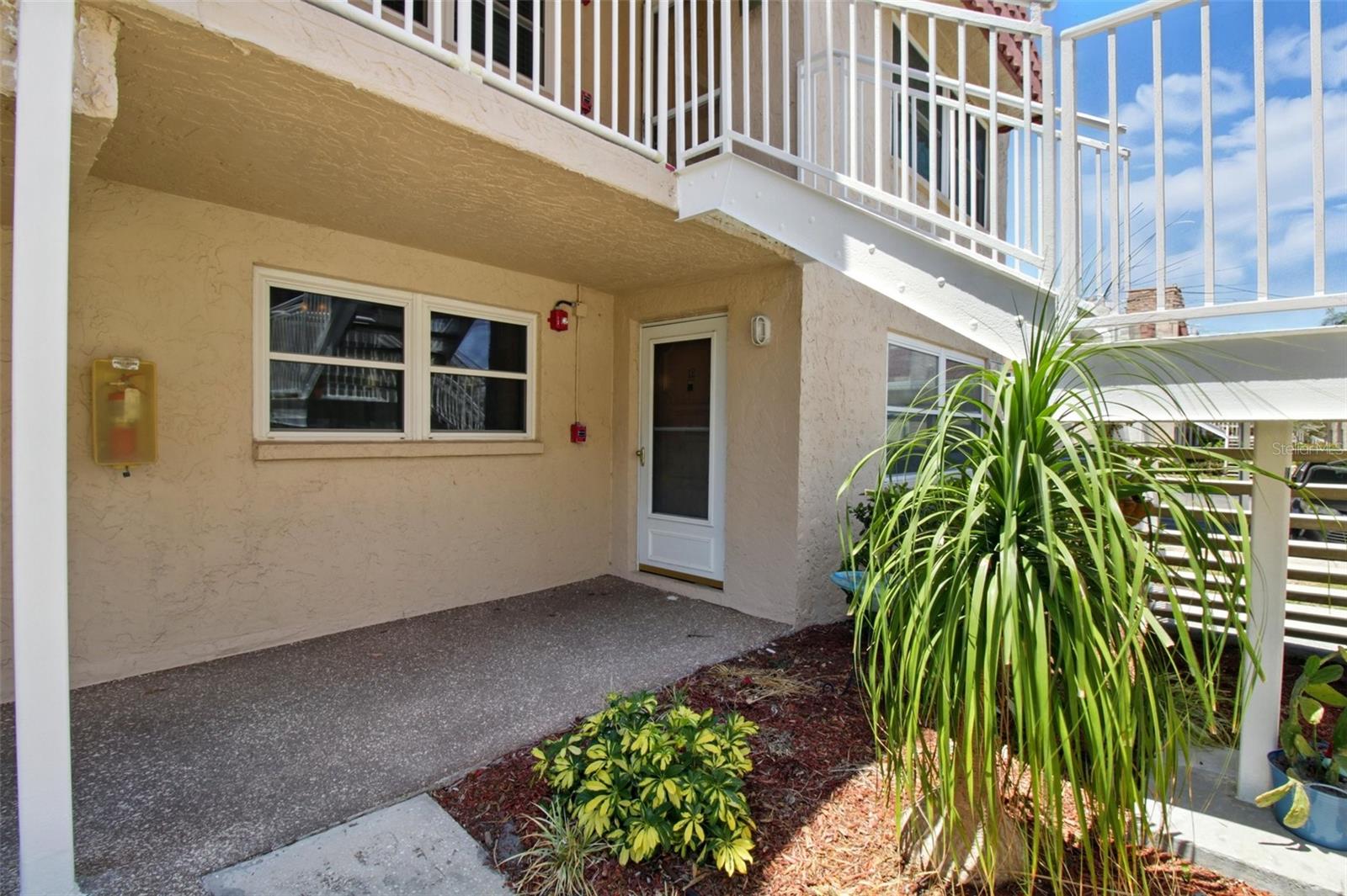 First floor corner unit at rear of property