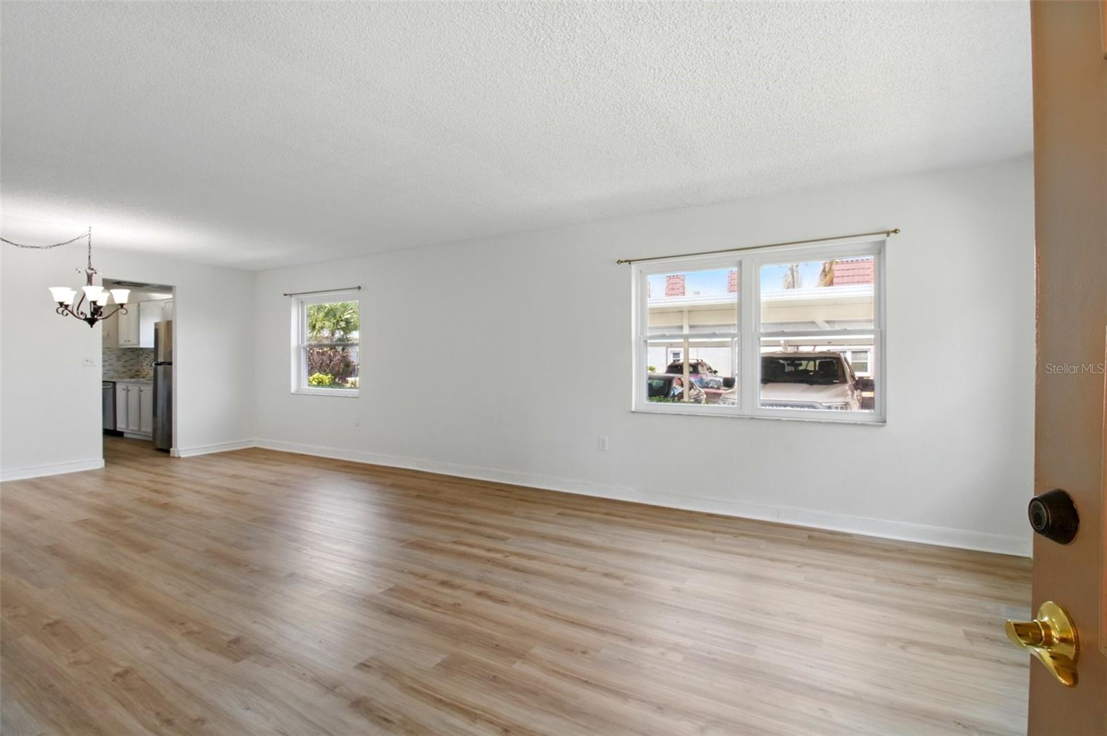 Entry into LR/DR combo with brand new laminate flooring