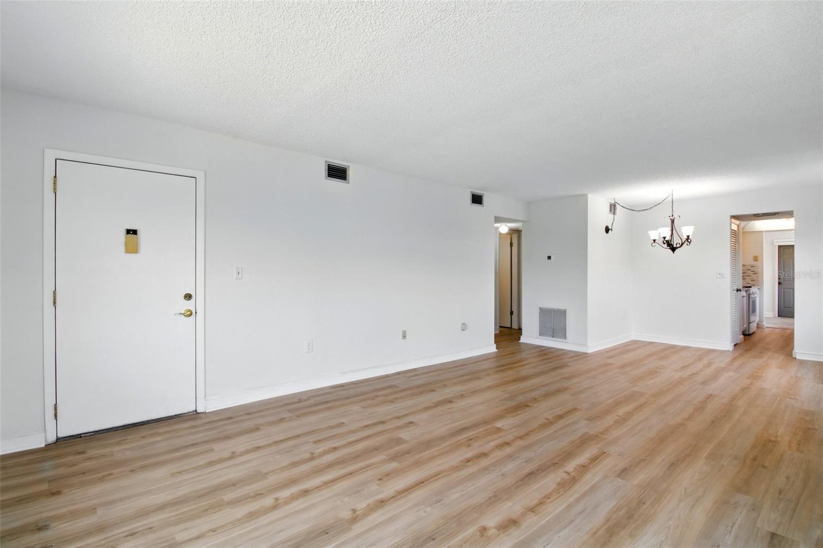 LR/DR looking back to entry door - new laminate flooring